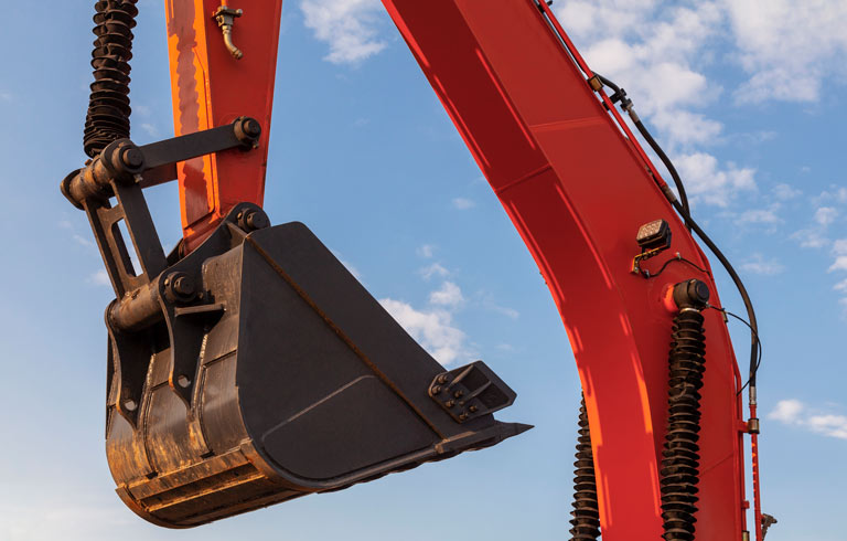 View of the arm of an excavator machine.