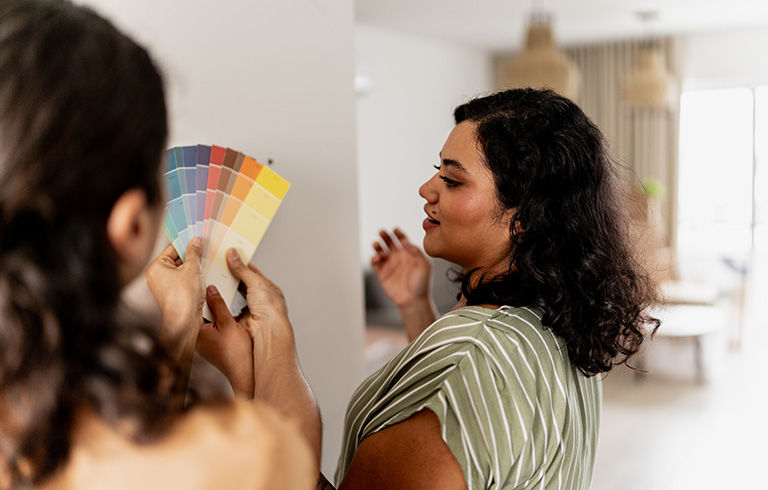 woman looking at paint swatches