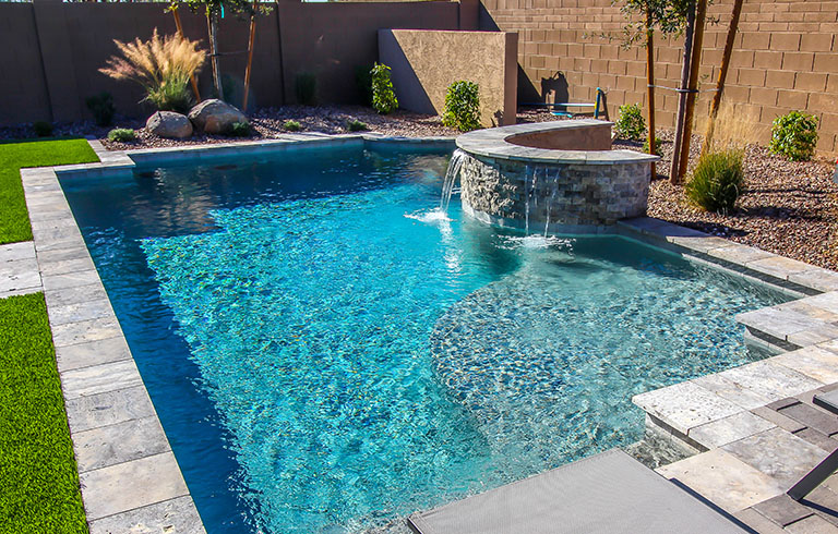 pool with a small waterfall feature