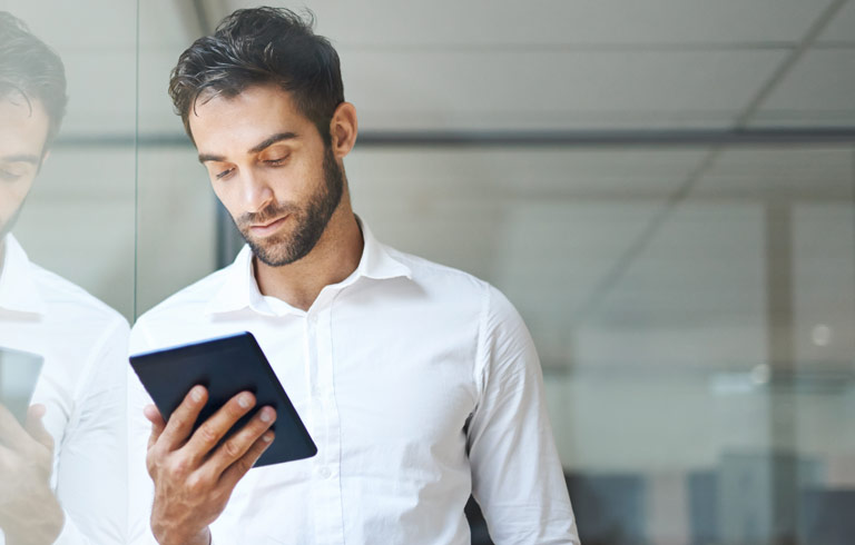 Businessman using a digital tablet in his office