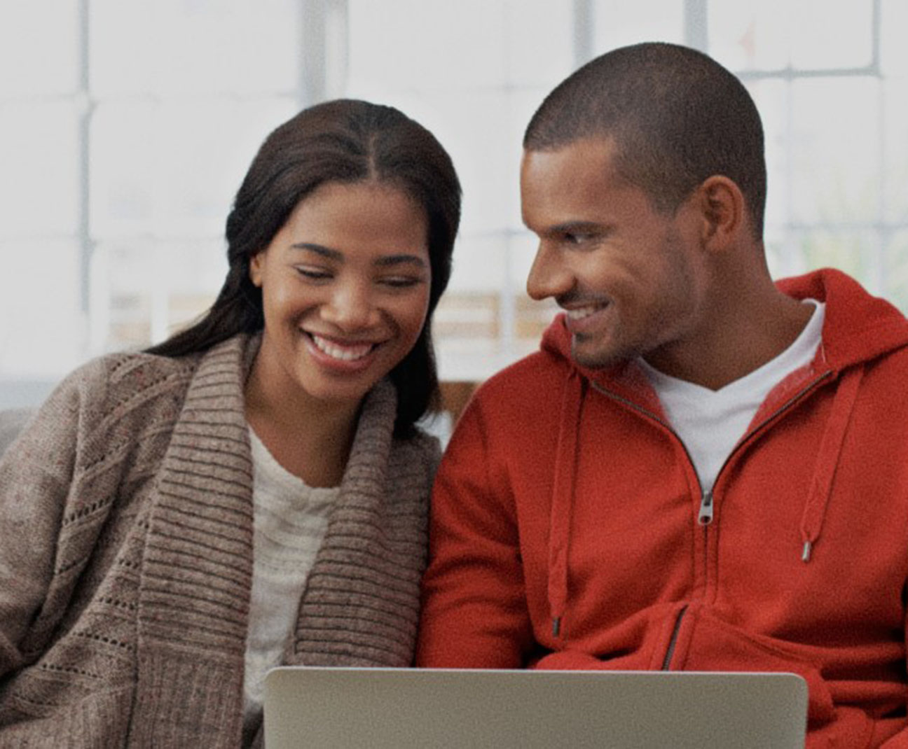 couple looking at a laptop