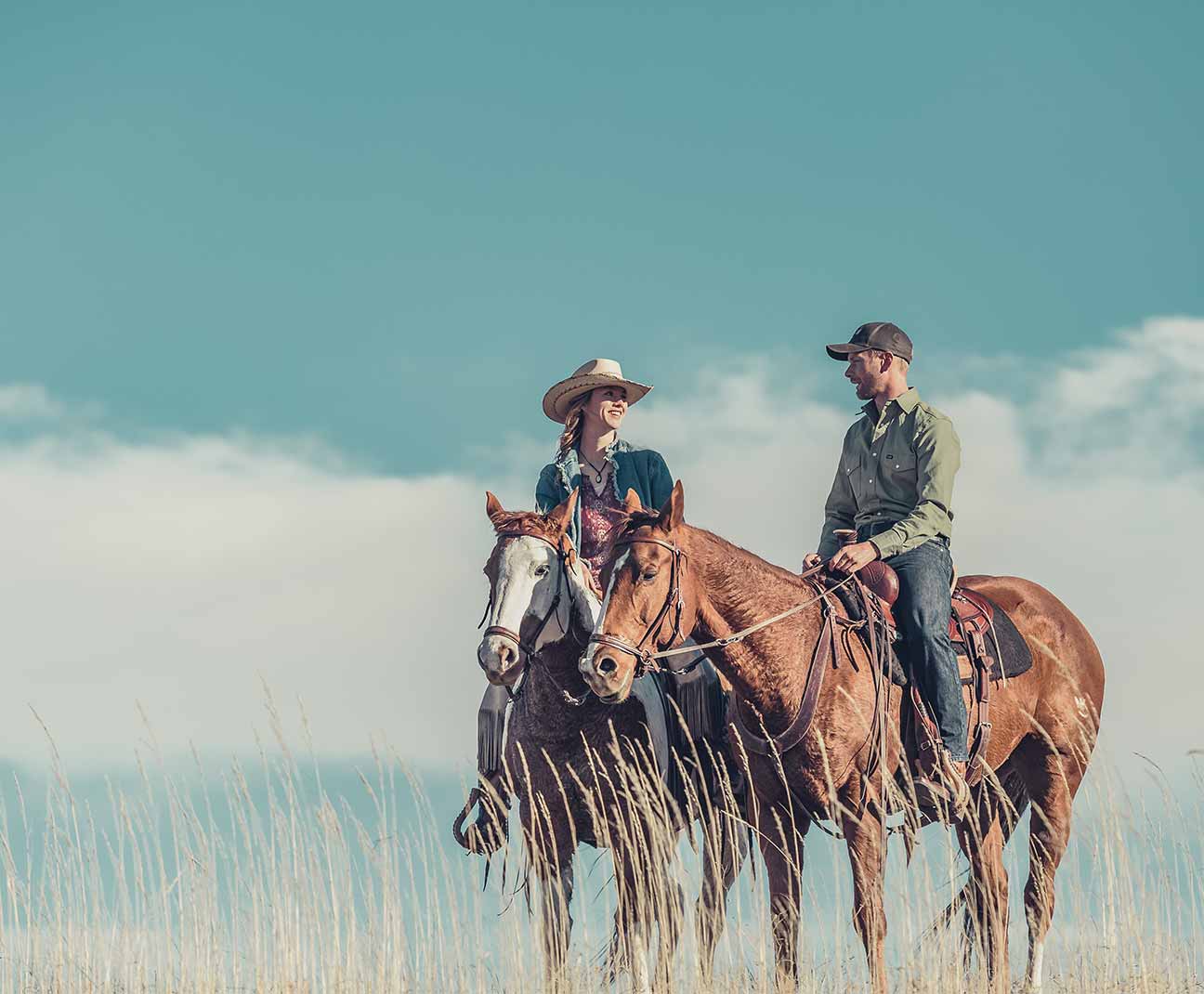 Couple riding horses