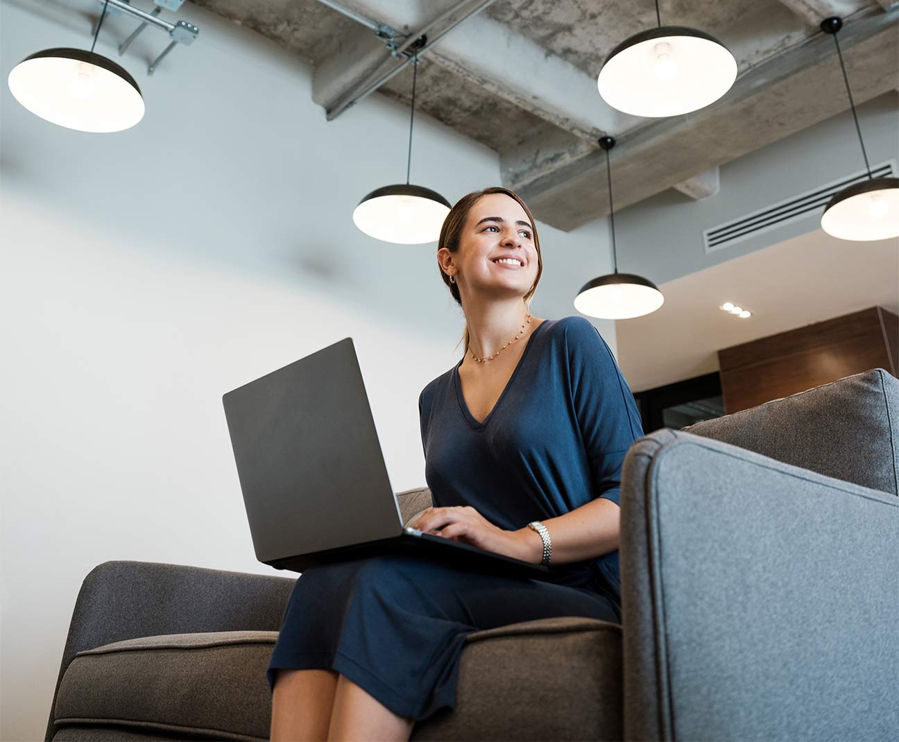 Businesswoman in office with laptop