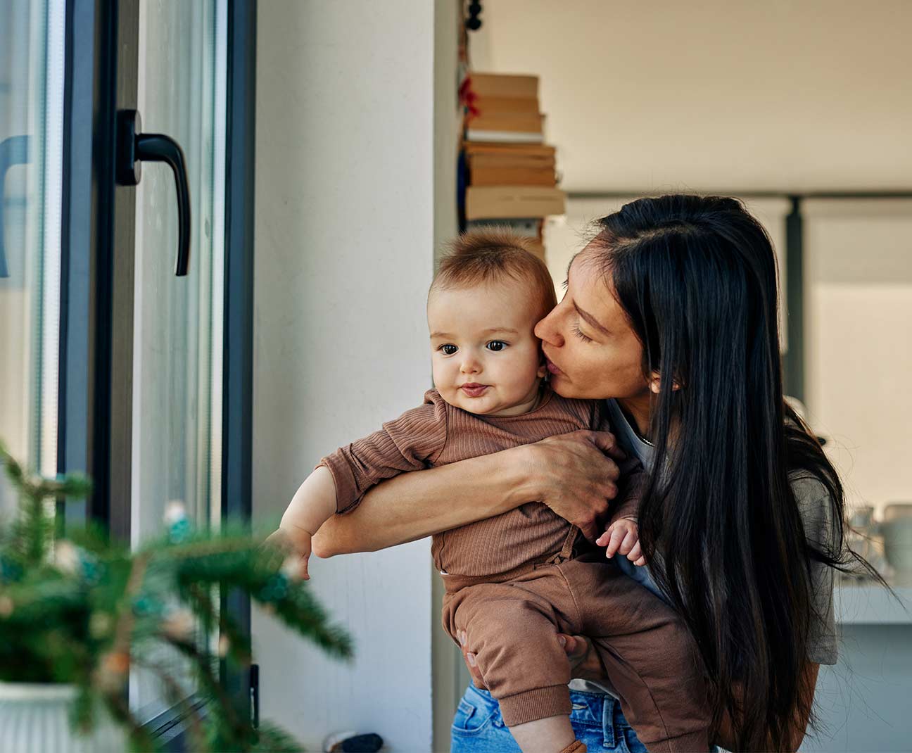 Woman holding her young baby