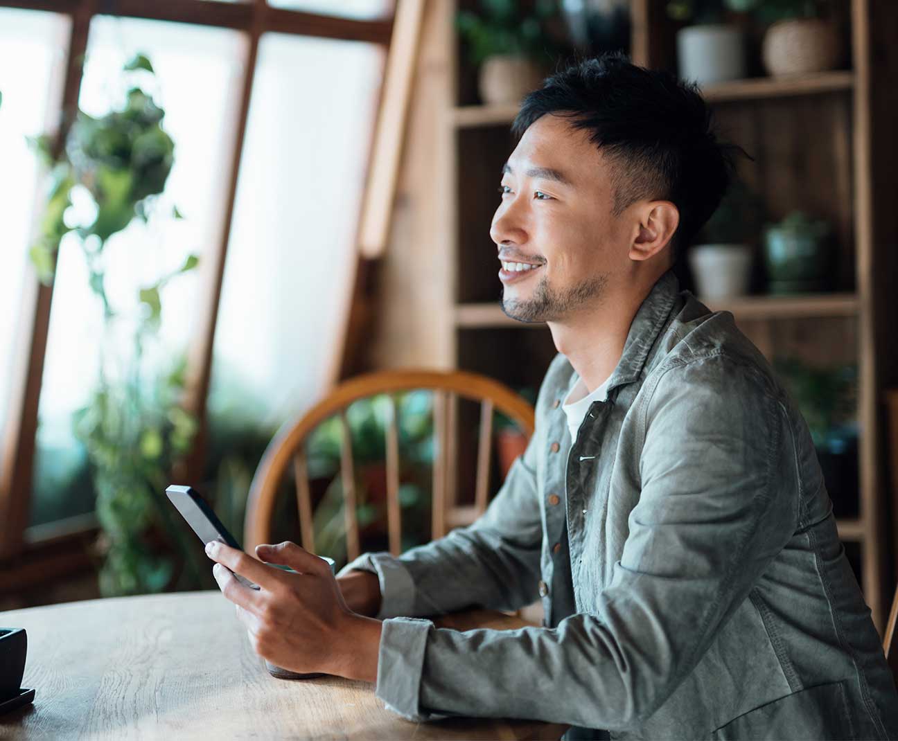 happy man using his cell phone