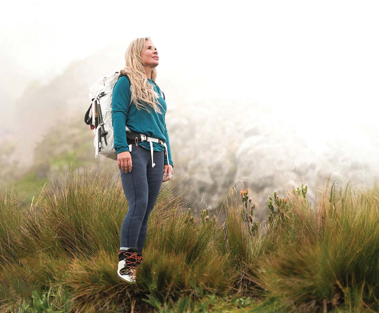 Jenn Drummond standing on a mountain