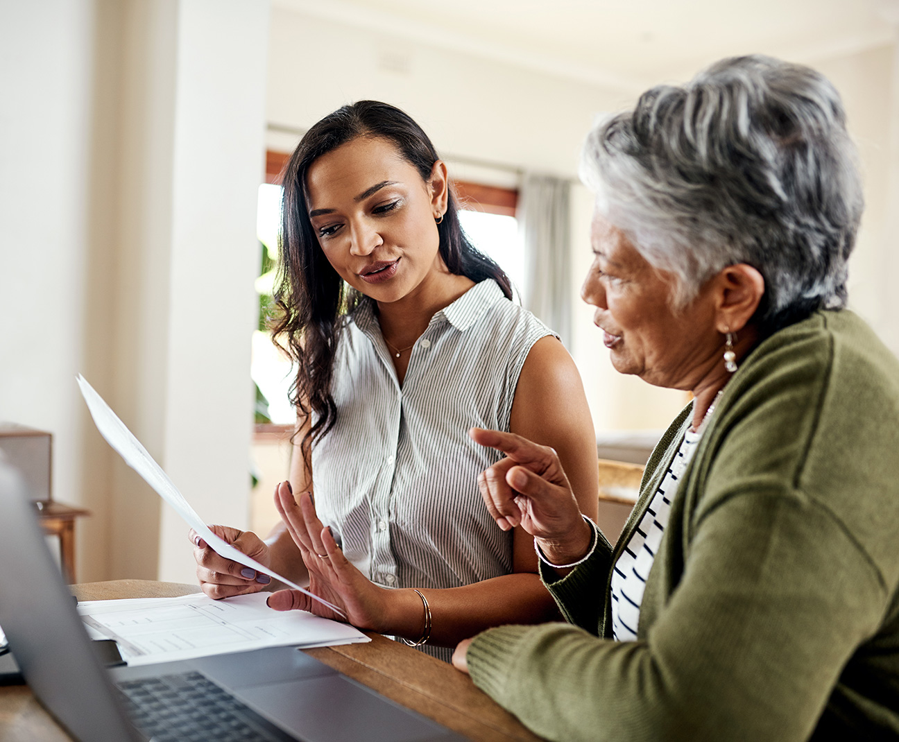 elderly woman helping daughter with retirement planning