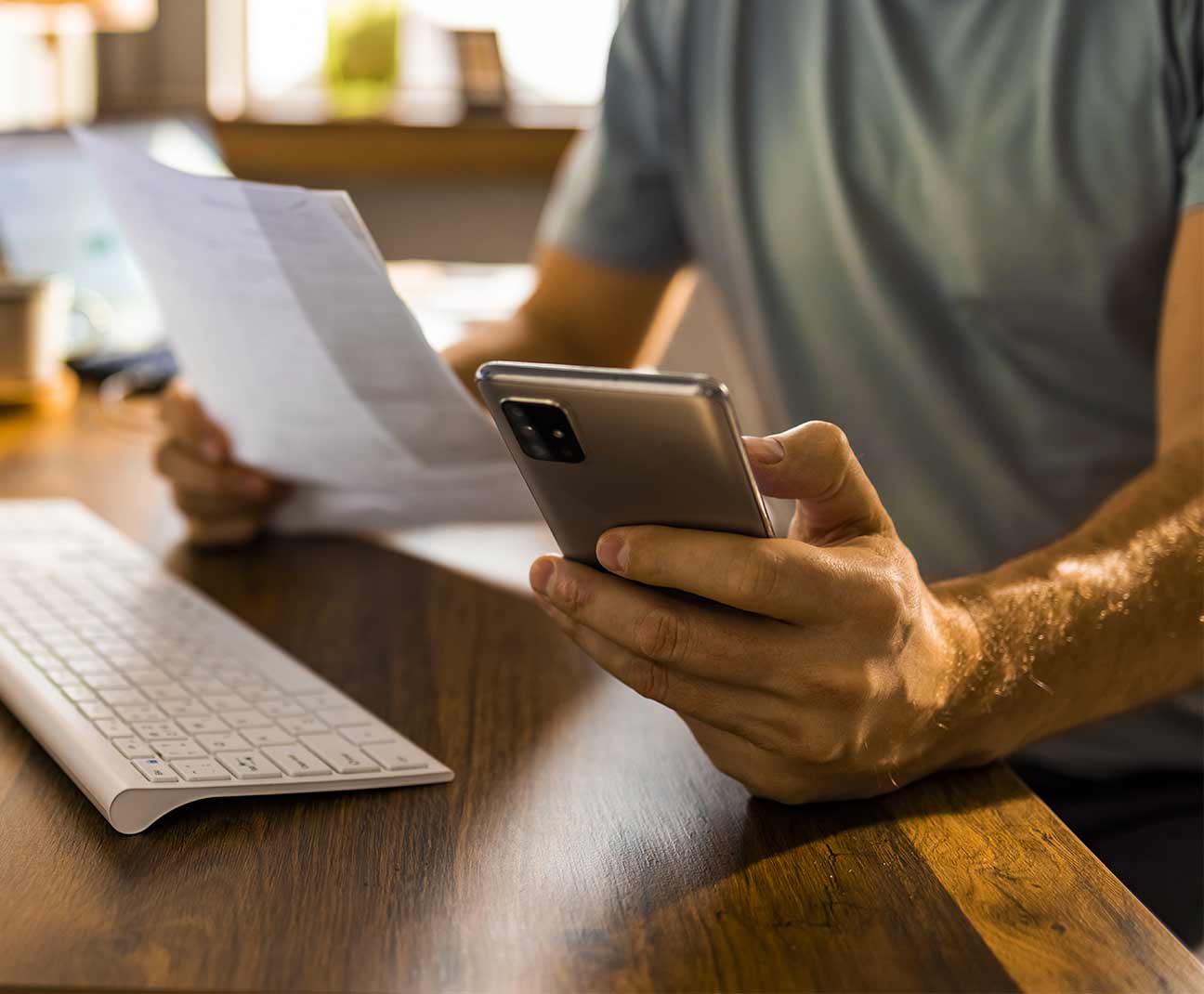 Man paying bills on his phone