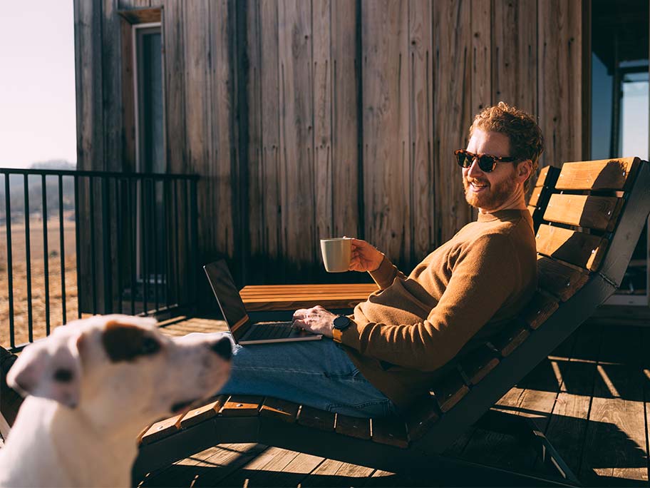 Man working on a laptop outdoors