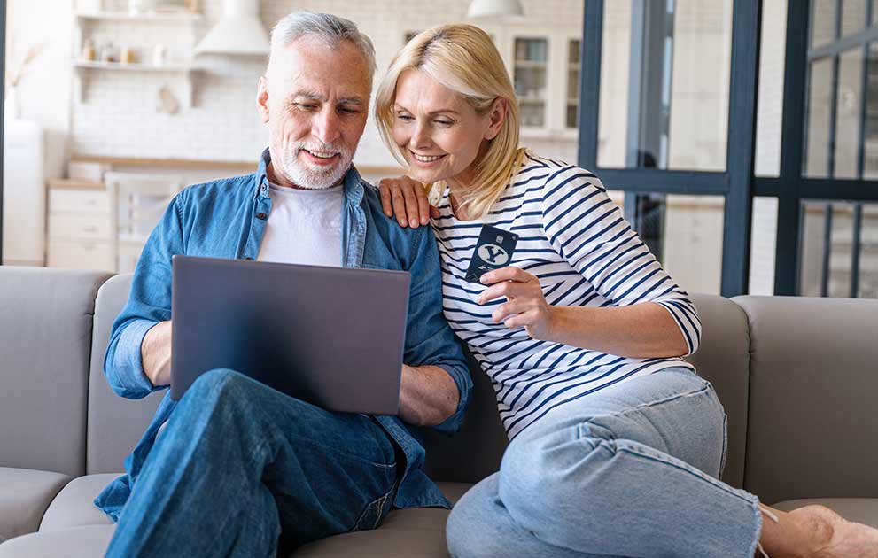 Couple on a sofa making an ecommerce purchase