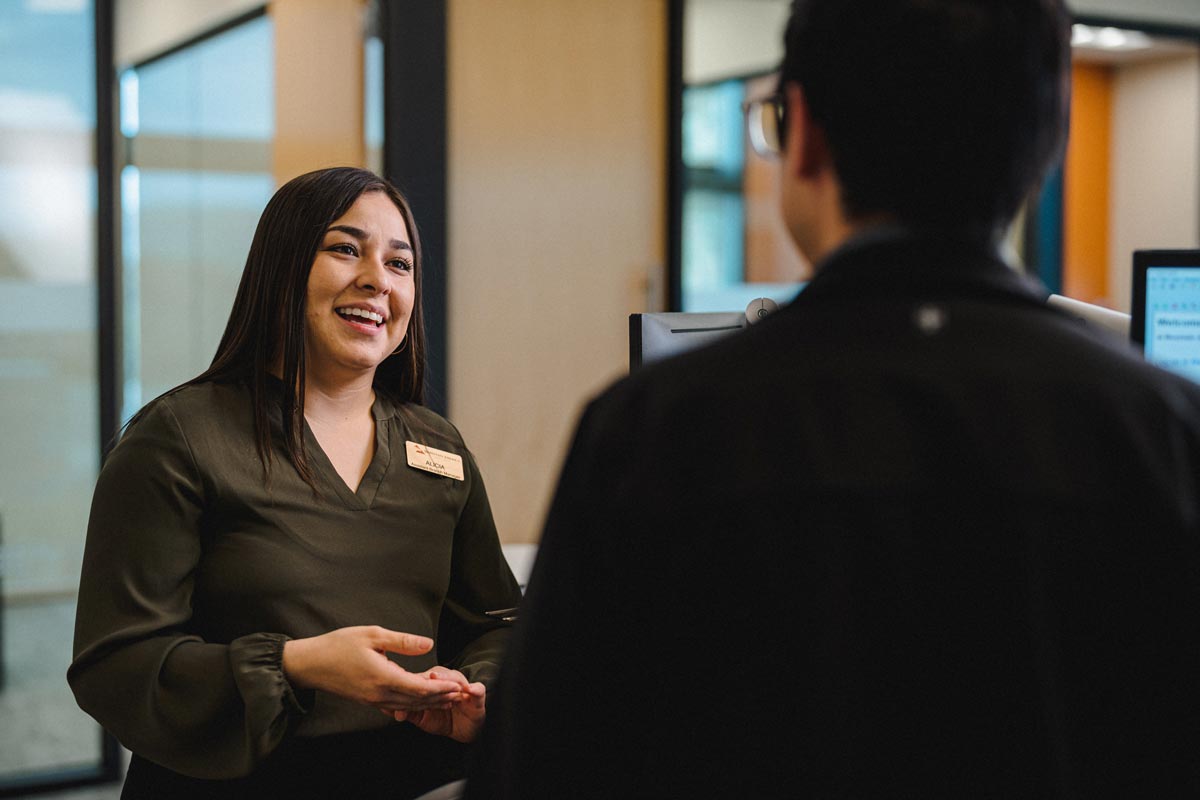 Mountain America team member talking to a member