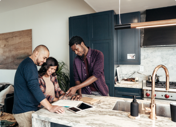 A father and daugher in the kitchen of their new home.