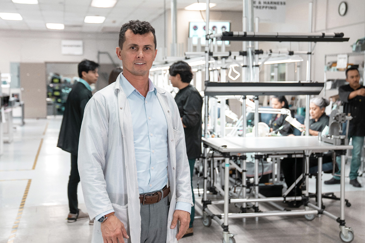 man in lab coat on factory floor