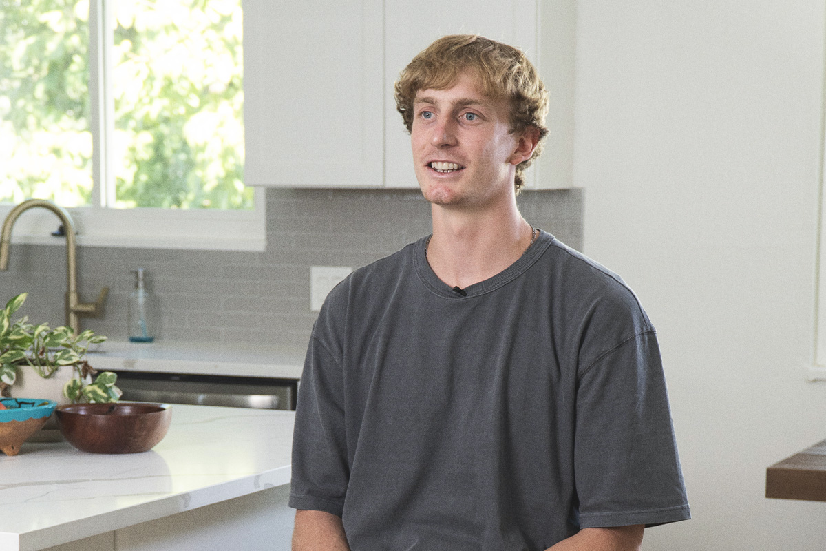 Richie Saunders basketball player sitting in his kitchen