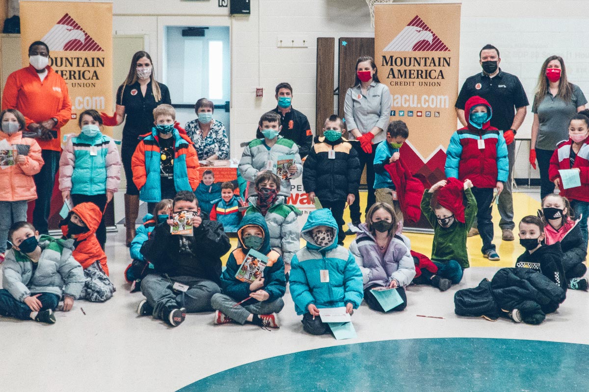 kids wearing coats donated by Mountain America and Operation Warm