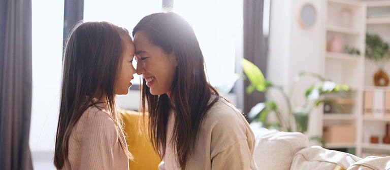 Mother embracing her daughter