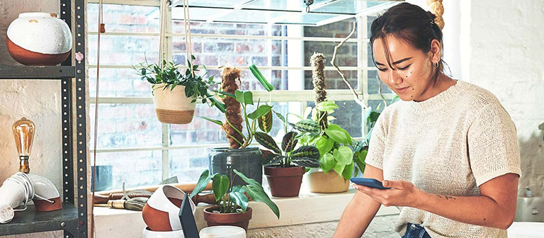 woman working on finances at her business