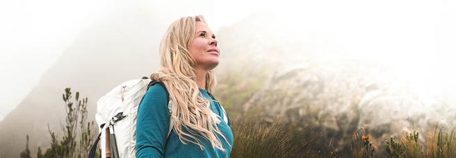 Jenn Drummond hiking a mountain